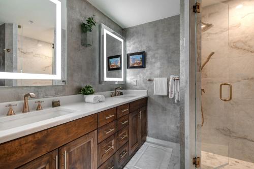 a bathroom with a large sink and a shower at Enjoy a Modern Luxury Design, Central Location, Hot Tub & Recreation! Deer Valley Fawngrove Estate in Park City