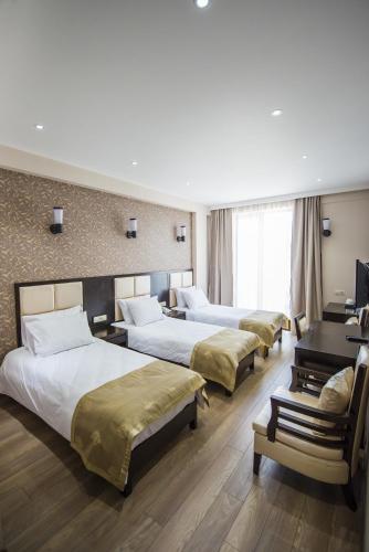 Llit o llits en una habitació de Tbilisi Inn