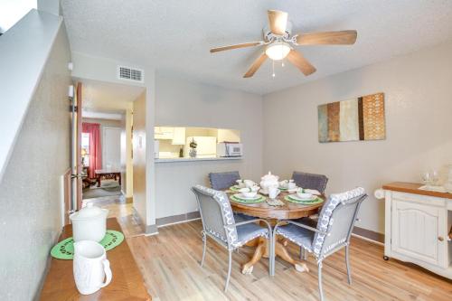 a dining room with a table with chairs and a ceiling fan at Convenient Harvey Apt - 12 Mi to French Quarter! in Harvey