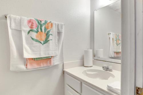 a bathroom with a sink and a towel on the wall at Convenient Harvey Apt - 12 Mi to French Quarter! in Harvey