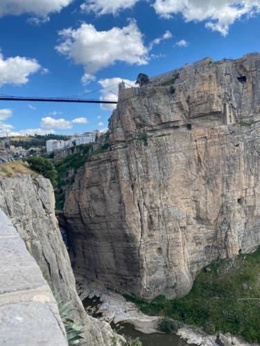 a view of a mountain with a suspension bridge at Hostel le Rhumel in Constantine