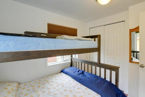 a bedroom with a bunk bed next to a window at Cozy Anchorage Retreat Less Than 4 Mi to Downtown! in Anchorage