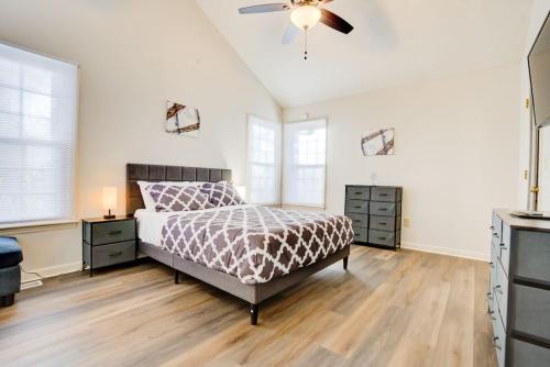 a bedroom with a bed and a ceiling fan at Top Choice Family Vacation House Walkable to Shops in Cary