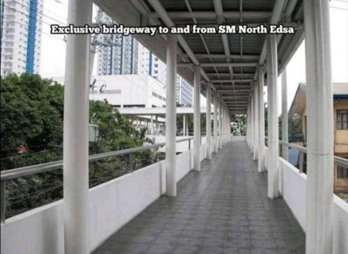 an empty walkway to and from smtn north bridge at SMDC 1 BR Grass Residence Tower 3 North Ave., QC in Manila
