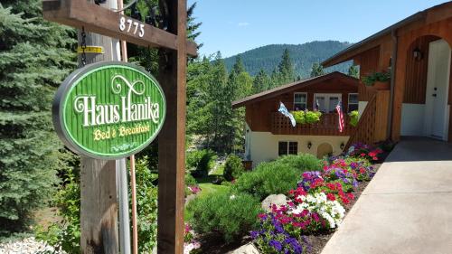 a sign for a flower farm in front of a house at Haus Hanika in Leavenworth