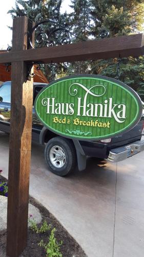 a sign for a hawkes hamka seafood and spaghetti restaurant at Haus Hanika in Leavenworth