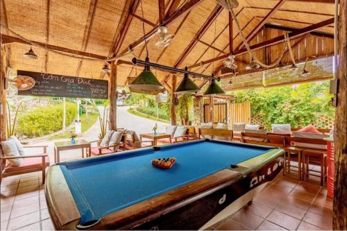 a pool table in the middle of a room at LANGCHIA HOME in Phu Quoc