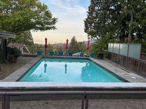 a swimming pool with a view of the mountains at Cypress: Private Bedroom/Bathroom/Office, with Shared Pool, Hot tub in North Vancouver