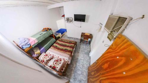 an overhead view of a room with a bed and a bed sqor at Hotel One in Monte Quemado