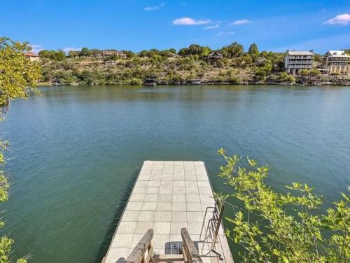 a dock on a body of water at A Rare Find! - Bright & Gorgeous Lake Home in Marble Falls in Marble Falls