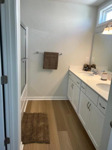 a bathroom with a sink and a mirror at Nurse's Nest LLC in Spartanburg