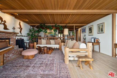 a living room with a couch and a fireplace at Villa Rylee in Malibu