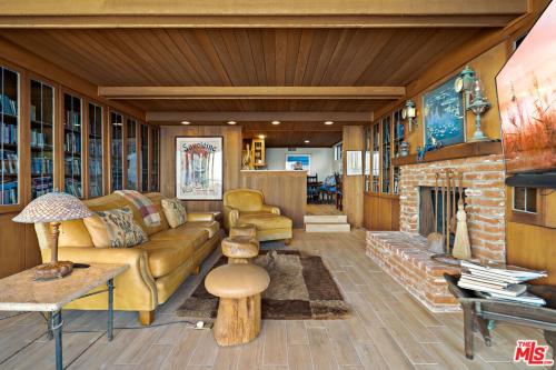 a living room with a couch and a fireplace at Villa Rylee in Malibu