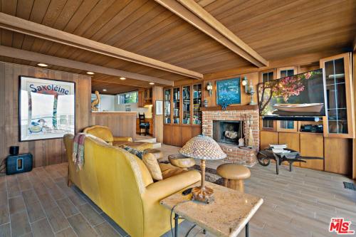 a living room with a couch and a fireplace at Villa Rylee in Malibu
