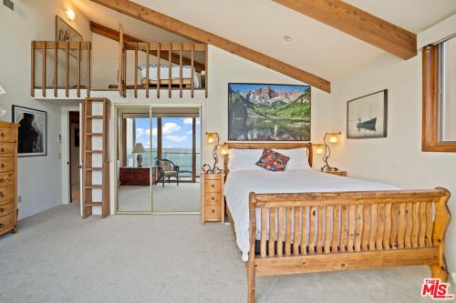 a bedroom with a bunk bed and a ladder at Villa Rylee in Malibu