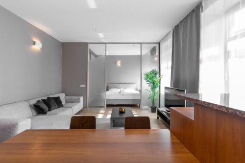 a living room with a couch and a table at Laurinska modern apartment in direct centrum of Bratislava, Air-condition in Bratislava