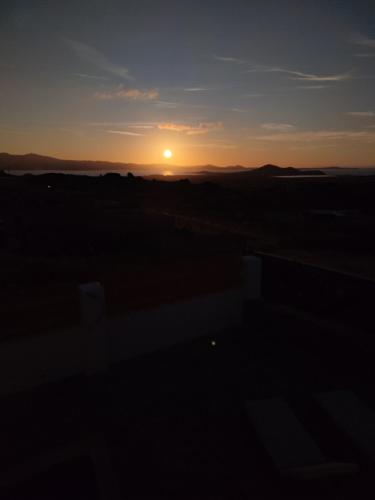 Amanecer o atardecer desde la casa vacacional o alrededores