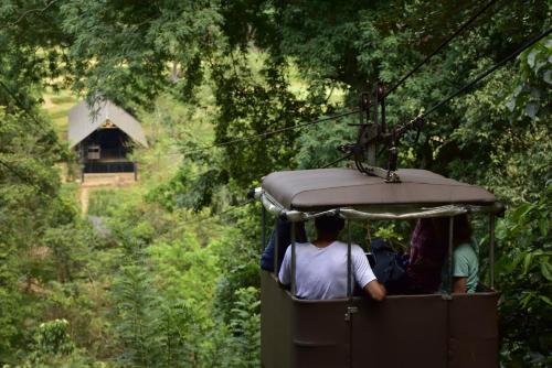 a group of people riding in a cable car at Clio Ella Adventure in Ella