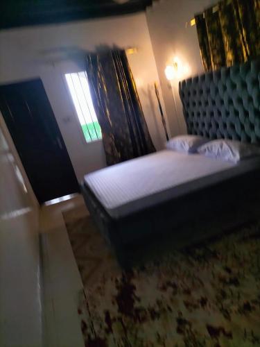 a bedroom with a bed and a window at Olympic Lamu sea front house - 2 bedroom All ensuite in Lamu