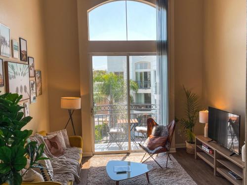 a living room with a couch and a window at Sunny 1BDR centrally located in Marina del Rey in Los Angeles