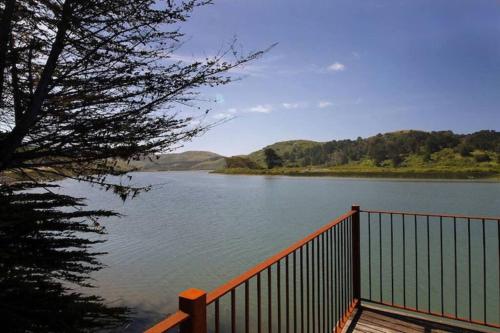 a view of a body of water with a wooden dock at 'Erinleigh By The Sea' Waterfront in Jenner