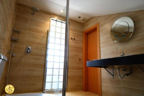a bathroom with a shower and a mirror at A4J Luxury in Mijas