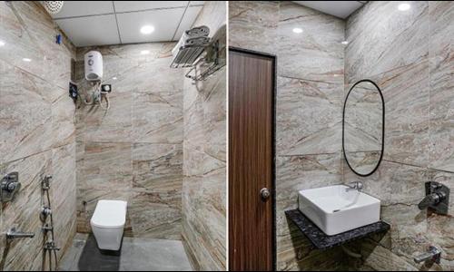 a bathroom with a sink and a toilet at FabHotel Fortune in Surat