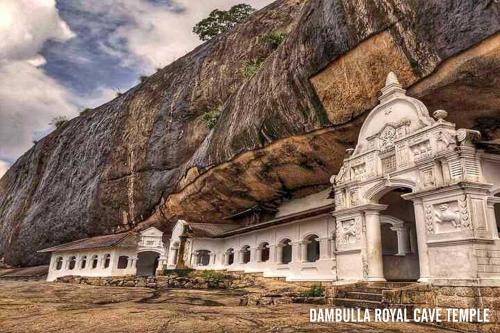 a building on the side of a mountain at Sigiriya Forest Edge By Marino Leisure in Sigiriya