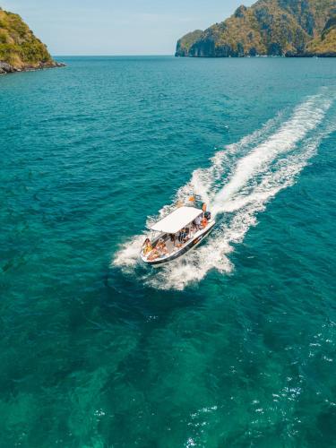 a boat with people on it in the water at Morgan Villas in El Nido