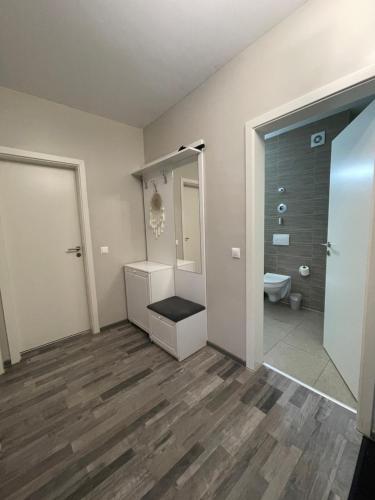 a bathroom with a toilet and a sink and a mirror at Home Sweet Home in Braşov