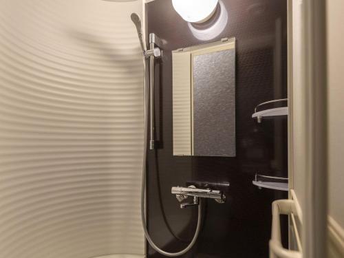 a bathroom with a shower and a sink at La Vista Tokyo Bay in Tokyo