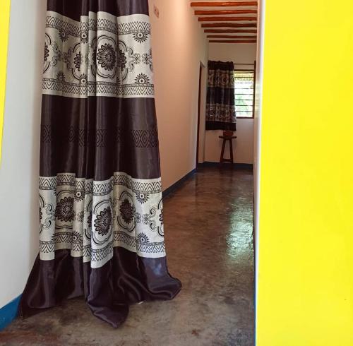 a curtain is hanging in a room at Karibu Paradaizi in Michamvi