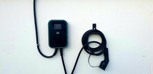 a black computer mouse with a cord on a wall at Alpenhotel Gastager in Inzell