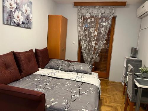Postel nebo postele na pokoji v ubytování Apartmani Asper