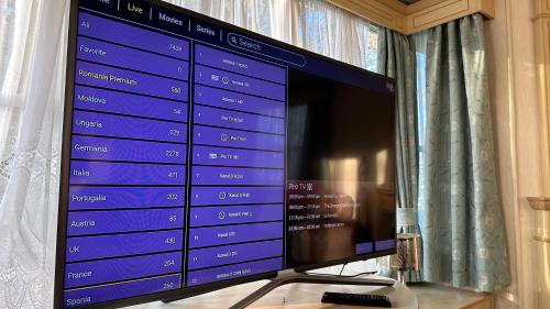 a flat screen tv sitting on top of a table at Getaway House in Clacton-on-Sea