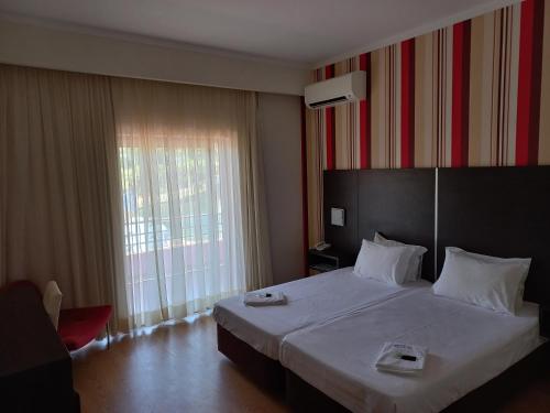 Giường trong phòng chung tại Hotel Lagar do Lago