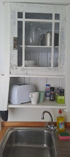 Kuchyň nebo kuchyňský kout v ubytování Plitzner Belvárosi Apartmanház