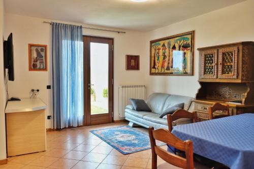 a living room with a couch and a table at Casa Aaron in Tremosine Sul Garda