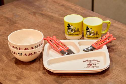 a tray with two cups and utensils on a table at Nara Top Sights 5 to 20 Min Walk in Nara