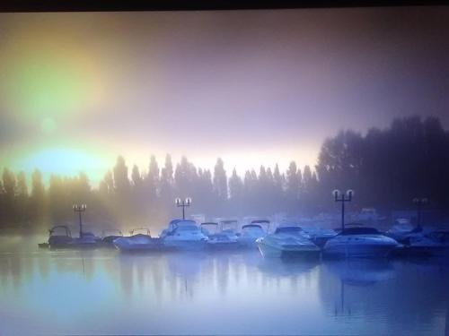 a group of boats are docked in the water at Aux 3 épis in Dienville