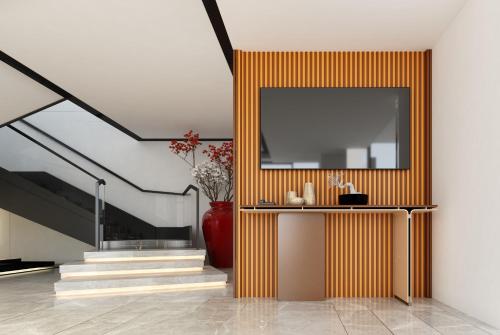 a hallway with a red vase and a staircase at Hyatt Centric Hebbal Bengaluru in Bengaluru