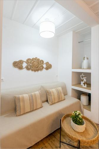 a living room with a couch and a table at Ziv Boutique Apartments Town Square II in Lefkada Town