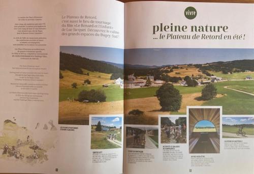 a book with a picture of a bridge and pictures at Au Château Saint Blaise in Virignin