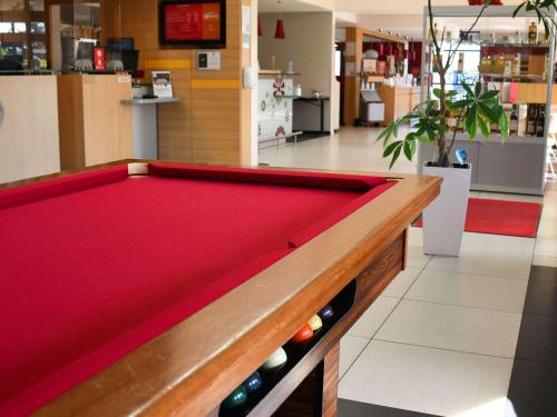 a pool table in the middle of a store at ibis Saintes in Saintes