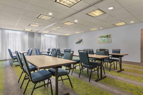 a conference room with tables and chairs in it at Spark By Hilton Winchester in Winchester
