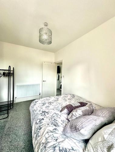 a bedroom with a bed with a pillow on it at Arthur Street in Hull