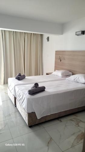 Katil atau katil-katil dalam bilik di Simos Magic Beach Hotel Apts