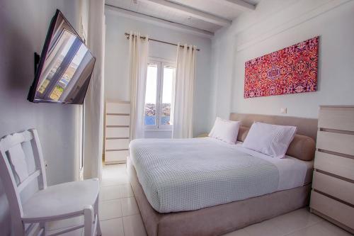 Amaris Mykonian Residenceにあるベッド