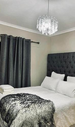 A bed or beds in a room at Sea Point Airbnb