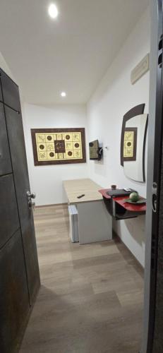 a room with a office with a desk and a counter at prestige house 5 in Scalea